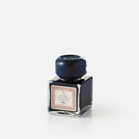 Cubic ink bottle with box