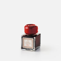Cubic ink bottle with box