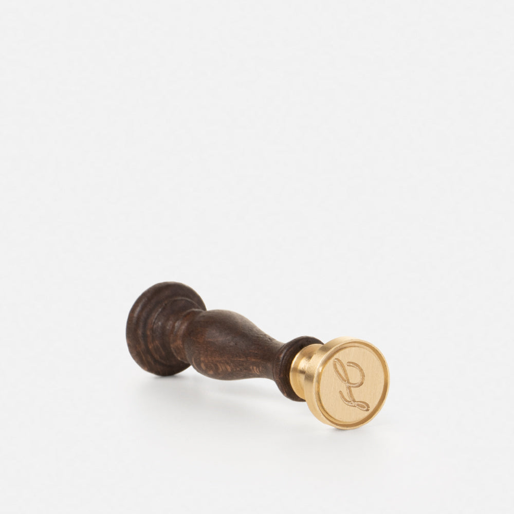 Brass seal, wooden handle and cursive initial (A-Z)